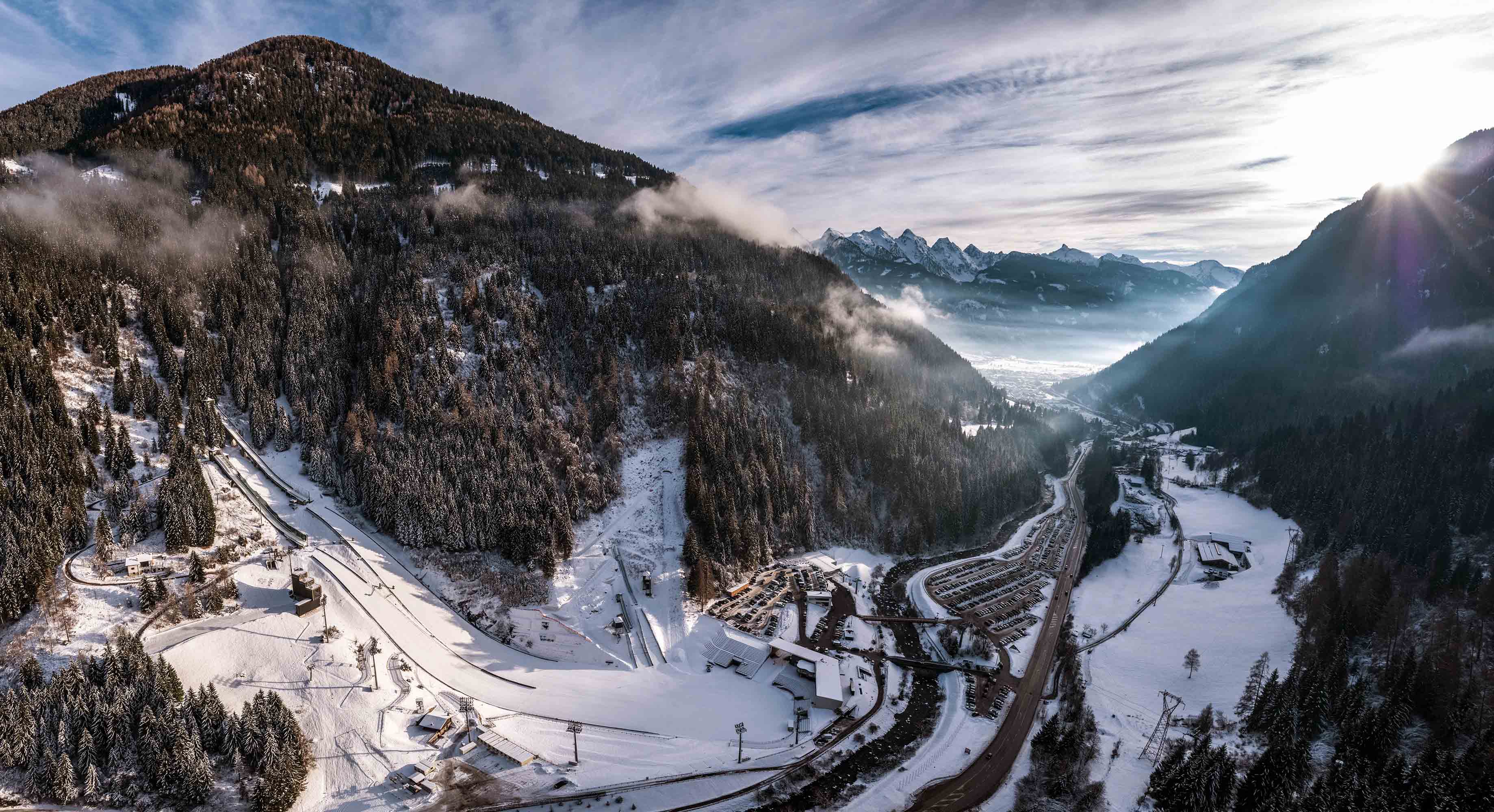 Evocative image of Predazzo amidst the peaks of the Dolomites