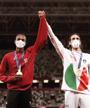 Tamberi and Barshim with masks and medals, standing side by side