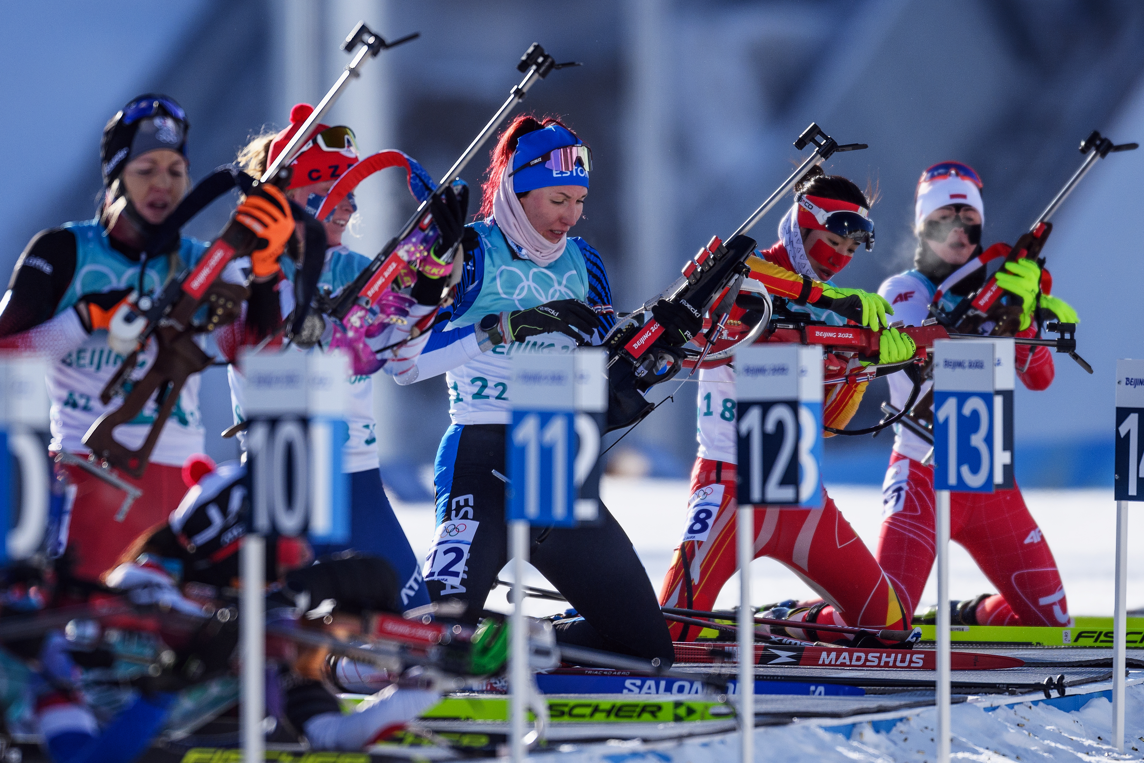 ZHANGJIAKOU, CHINA - FEBRUARY 16: Athletes shoot during the second leg of the Women's Biathlon 4x6km Relay on day 12 of 2022 Beijing Winter Olympics at National Biathlon Centre on February 16, 2022 in Zhangjiakou, China. (Photo by Matthias Hangst/Getty Images)