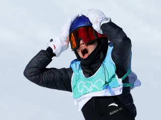 Athlete with hands on head while shouting