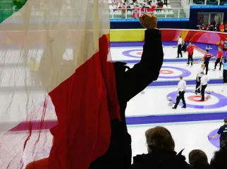 An Italian fan cheers on his team during a match against Finland during a preliminary round of men's curling on Day 9 of the Turin 2006 Winter Olympic Games on February 19, 2006 at Palaghiaccio in Pinerolo near Turin, Italy. Finland won the match 7-4. (Photo by Brian Bahr/Getty Images)